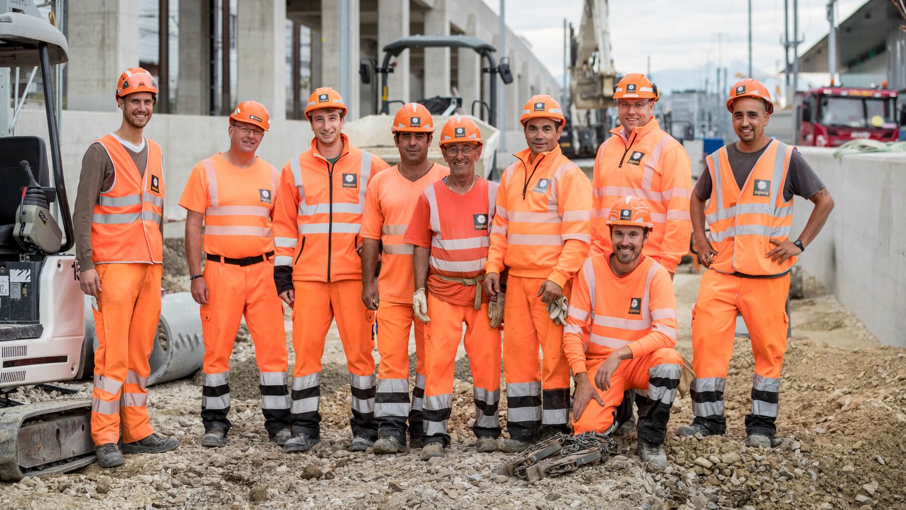 Eine Gruppe von Implenia Mitarbeiter auf einer Baustelle in Lausanne